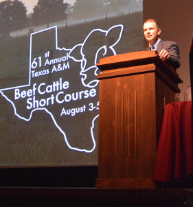 Dr. Jason Cleere, Texas A&M AgriLife Extension Service beef cattle specialist and Texas A&M Beef Cattle Short Course coordinator, leads off the general session. (Texas A&M AgriLife Extension Service photo by Blair Fannin) 
