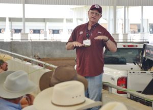 Dr. Monte Rouquette , Texas A&M AgriLife Research forage physiologist, Overton, discusses sampling for hay quality at 2019 Beef Cattle Short Course (Texas A&M AgriLife Communications photo by Adam Russell)